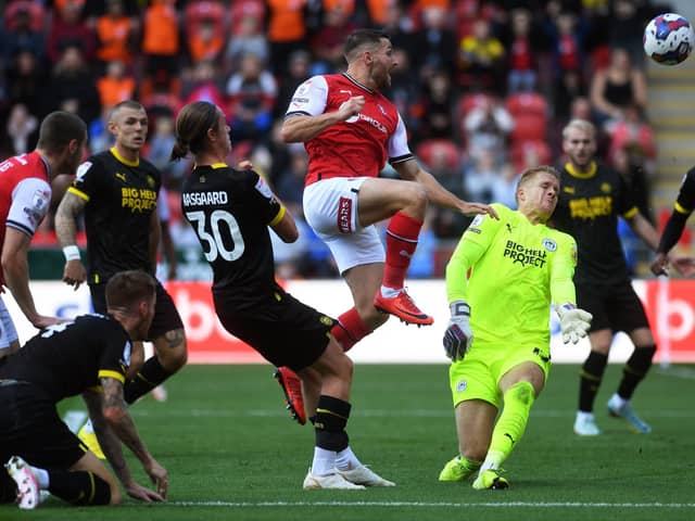 DENIED: Wigan Athletic's Ben Amos saves from Conor Washington on a day when clear Rotherham United chances were rare