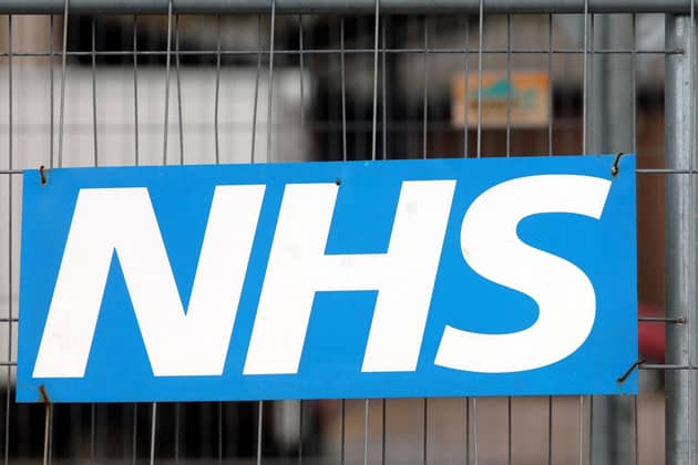 An NHS sign on a fence at a Hospital. PIC: PA
