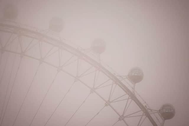 Pods on the London Eye are pictured in the fog in central London on December 7, 2020. Pic: Getty Images.