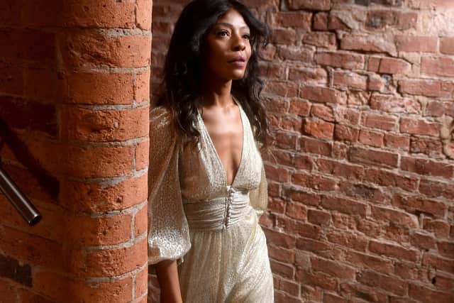 Model and singer Pearl Natasha wears a gold metallic Ba&sh dress at the Fling fashion rental showroom at Mabgate Mills In Leeds. The average rental costs £55-£75 for a two-day rental. Picture by Yorkshire Post photographer Simon Hulme