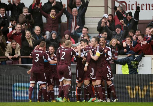 Hearts players celebrate BIlly King's goal