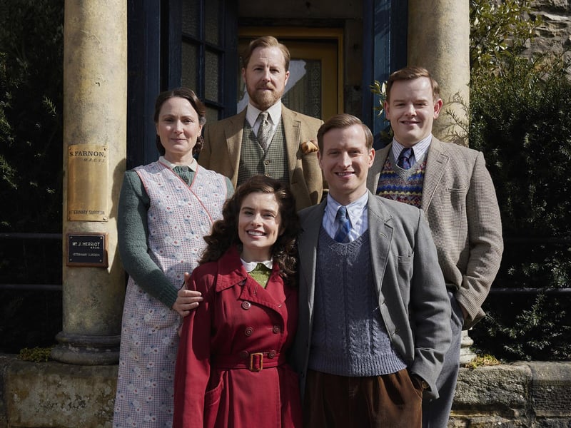 A gorgeous portrait outside Skeldale House: L-R clockwise: Samuel West (Siegfried Farnon), Callum Woodhouse (Tristan Farnon), Nicholas Ralph (James Herriot), Rachel Shenton (Helen Herriot), Anna Madeley (Mrs Hall) exterior Skeldale House