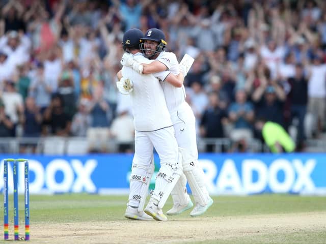 Chris Woakes celebrates with team-mate Mark Wood after hitting the winning runs at Headingley. Photo by Ashley Allen/Getty Images.
