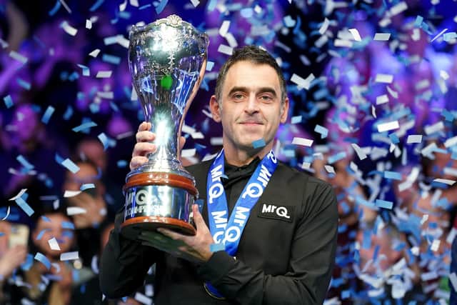Ronnie O'Sullivan celebrates with the trophy after winning the final against Ding Junhui on day nine of the 2023 MrQ UK Championship at the York Barbican (Picture: Mike Egerton/PA Wire)
