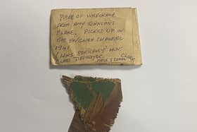 Amy Johnson aircraft fragment with the 1950s envelope it was stored in.