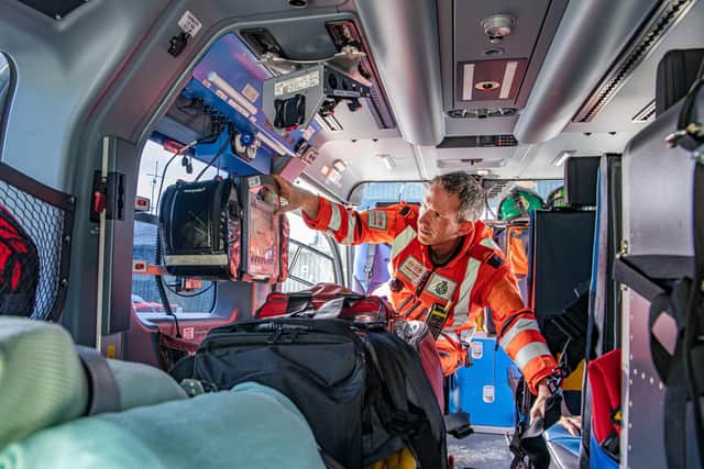 Yorkshire Air Ambulance crew member Dr Steve Rowe, who has been working for the YAA since September 2008, checks the equipment onboard the aircraft. (Pic credit: Tony Johnson)