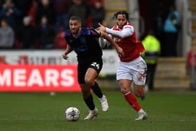 Rotherham United's Sam Nombe challenges Huddersfield Town rival Radinio Balker. Picture: Jonathan Gawthorpe.