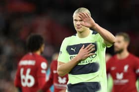 Manchester City's Norwegian striker Erling Haaland gestures to supporters as he leaves after the English Premier League football match between Liverpool and Manchester City at Anfield in Liverpool, north west England on October 16, 2022. (Photo by OLI SCARFF/AFP via Getty Images)