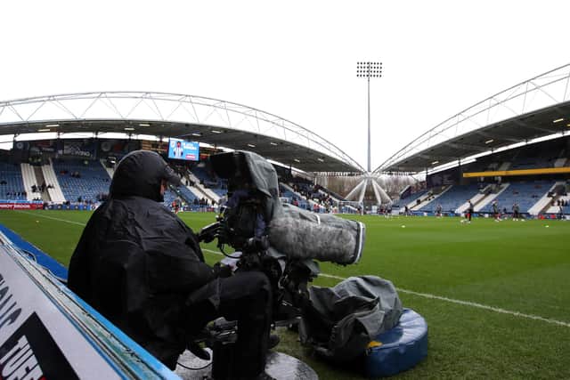 HUDDERSFIELD, ENGLAND - FEBRUARY 12: A TV camera operator is seen pitch-side prior to the Sky Bet Championship match between Huddersfield Town and Sheffield United at Kirklees Stadium on February 12, 2022 in Huddersfield, England. (Photo by George Wood/Getty Images)