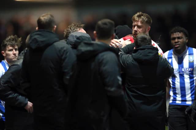 Fleetwood Town's Shaun Rooney (2nd from right) reacts as he leaves the pitch after being shown a red card during the Sky Bet League One match at Highbury Stadium, Fleetwood. Picture: Barrington Coombs/PA