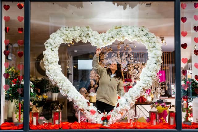Lisa Parr in the window of Earth Things florist in Elland.
Picture By Yorkshire Post Photographer,  James Hardisty.