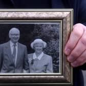 John Ledgard, a victim of the family trust scandal, holds a picture of his mum Mary Ledgard and her husband Barrie. PIC: Simon Hulme