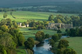 Early morning sunshine illuminates Bolton Abbey in Wharfedale, North Yorkshire, England, takes its name from the ruins of the 12th-century Augustinian monastery now known as Bolton Priory