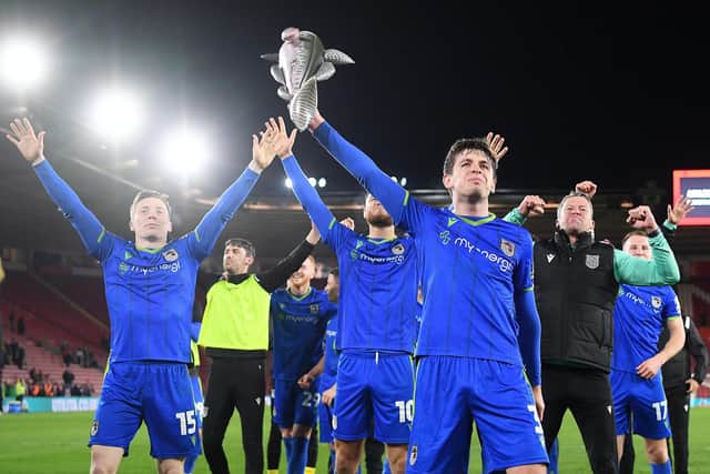 Anthony Driscoll-Glennon of Grimsby Town celebrates victory at full time holding Harry Haddock an inflatable fish after Grimsby shocked Southampton (Picture: Alex Davidson/Getty Images)