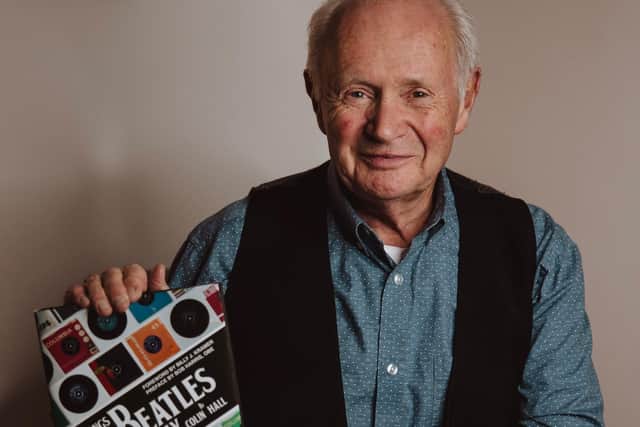 Colin Hall with his book The Songs The Beatles Gave Away. Picture: Toby Clark.