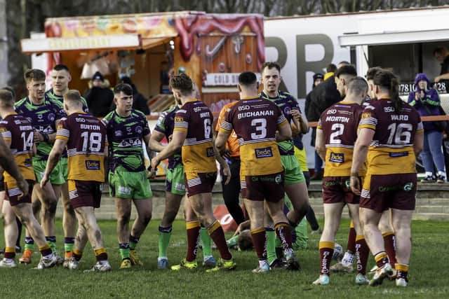 Batley and Castleford players shake hands after the match. (Photo: Allan McKenzie/SWpix.com)