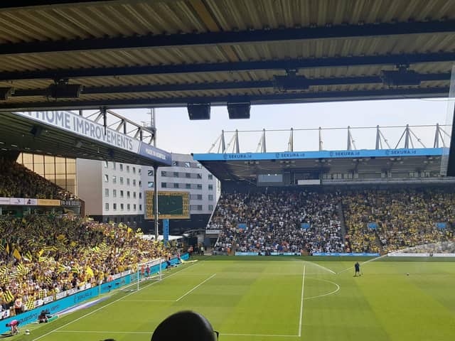 SUPPORT: Leeds United fans were housed in Carrow Road's South Stand on Sunday,. The incident is alleged to have taken place behind the Barclays Stand (left)