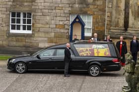 The hearse carrying the coffin of Queen Elizabeth II arrives at Palace of Holyroodhouse, Edinburgh. (Pic credit: Lisa Ferguson / PA)