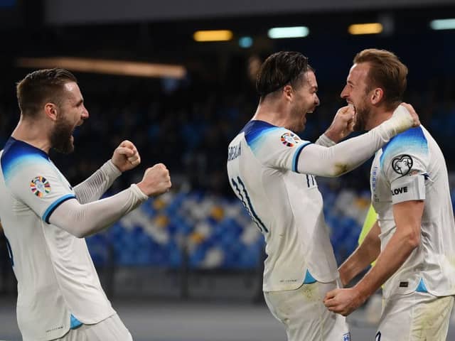 NAPLES, ITALY - MARCH 23: Harry Kane of England celebrates with team mates Luke Shaw and Jack Grealish of England after scoring their sides second goal during the UEFA EURO 2024 qualifying round group C match between Italy and England at Stadio Diego Armando Maradona on March 23, 2023 in Naples, Italy. (Photo by Michael Regan/Getty Images)