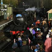 People wait to board the North Yorkshire Moors Railway's Whitby Winter Excursion at Pickering Station