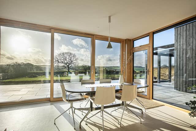 The dining area with sensational views thanks to the  full height, triple glazing