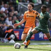 Plymouth Argyle's Bali Mumba and Hull City's Lewis Coyle in action during the Sky Bet Championship match at Home Park. Photo: Steven Paston/PA Wire.