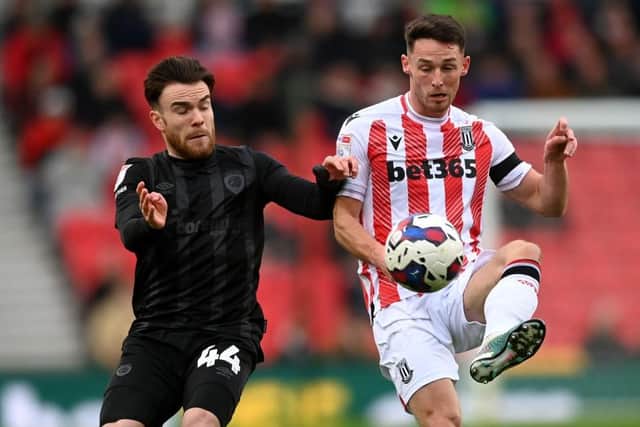 SETBACKS: Aaron Connolly (left) did not play for Hull City after February's trip to Stoke City