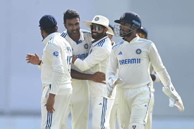 Ashwin is congratulated by his team-mates. Photo by Gareth Copley/Getty Images.