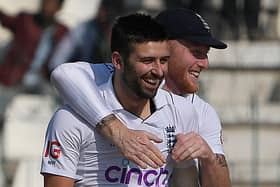 Smiles on faces: England's Mark Wood, left, celebrates with his captain Ben Stokes after taking the decisive wicket of Pakistan's Saud Shakeel on the fourth day of the second Test in Multan. (Picture: AAMIR QURESHI/AFP via Getty Images)
