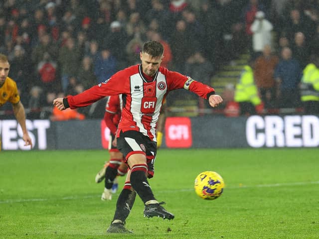 MASSIVE MOMENT: Oliver Norwood scores the penalty which brought Sheffield United's first win of the season, against Wolverhampton Wanderers