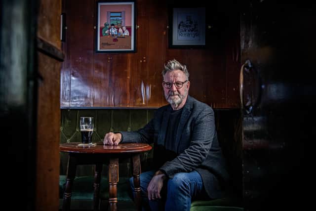 Sheffield artist Pete McKee in Fagans pub where he painted his famous mural The Snog which is the subject of a new exhibition, photographed for the Yorkshire Post Magazine by Tony Johnson.