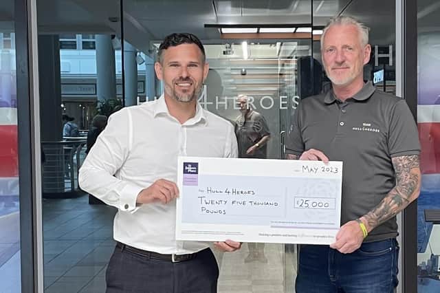Navigation Wealth’s CEO Matt Hammond presents a cheque for £25,000 to Paul Matson BEM, founder of Hull 4 Heroes.