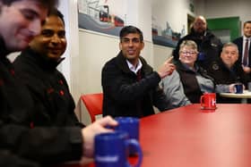 Prime Minister Rishi Sunak meets with bus drivers during his visit to a bus depot in Harrogate, North Yorkshire.
