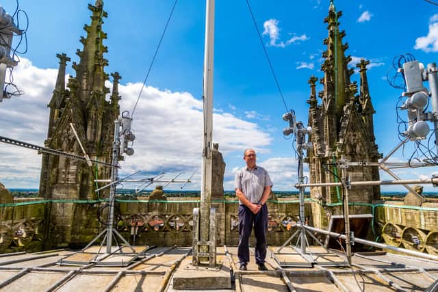 Selby Abbey in North Yorkshire, is planning to open up their Tower Tours once again on Sundays throughout summer, including the ringing room, clock room, bell chamber and the incredible views from the roof of the Central Tower. Pictured Andrew Twineham, Verger and one of the Bell Ringers on the roof of the Central Tower of Selby Abbey. Picture By Yorkshire Post Photographer,  James Hardisty.