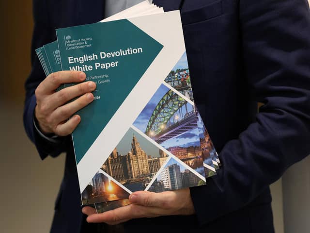 A person holds copies of the 'English Devolution White Paper' following the launch by Deputy Prime Minister Angela Rayner in Leeds. PIC: Phil Noble/PA Wire