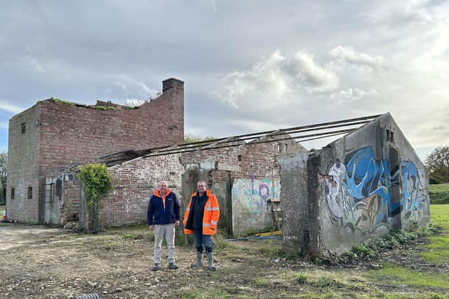 Tony and Carl with one of the old buildings on the airfield