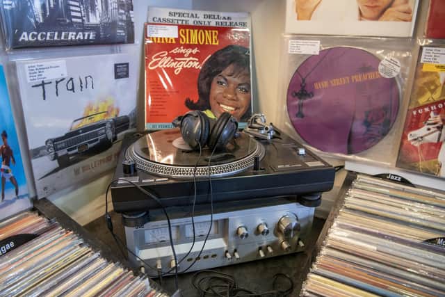 A turntable in the corner of Steve Mathie's Spin It Records shop, one of the country's oldest vinyl stores which is celebrating its 30th anniversary of being in Trinity Market in Hull photographed by Tony Johnson for The Yorkshire Post. 29th March 2024
