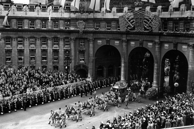 Queen Elizabeth II’s Coronation carriage and procession coming through Admiralty Arch on the way from Westminster Abbey to Buckingham Palace.