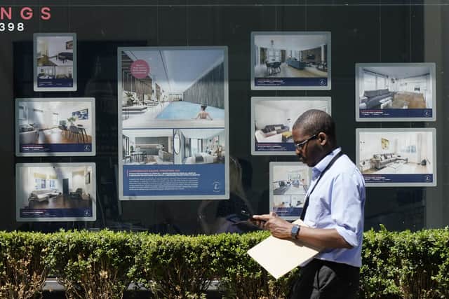 A man walks past an estate agents in London. Picture: Aaron Chown/PA Wire