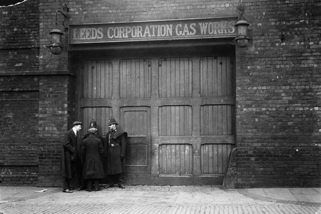 16th December 1913:  A couple of policemen stand guard outside the Leeds Corporation Gas Works, during the Leeds municipal workers strike of 1913.
