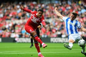 Middlesbrough v Huddersfield Town. Boro's Sammy Silvera gets a shot on goal, despite the attention of Terriers captain Jonathan Hogg. Picture: Jonathan Gawthorpe.