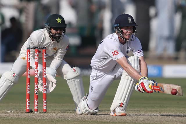 Harry Brook reverse sweeps Mohammad Rizwan on day three of the Karachi Test. Photo by Matthew Lewis/Getty Images.