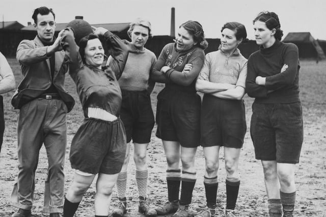 Edlington Women's Football players received instructions from coach James Bott during a training session in May 1939 at the playing fields in Edlington, Doncaster.
