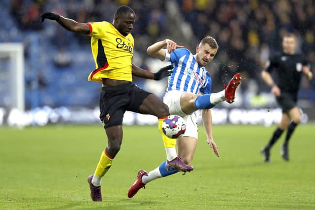 Watford's Ismaila Sarr (left) and Huddersfield Town's Michal Helik battle for the ball (Picture: Will Matthews/PA Wire)