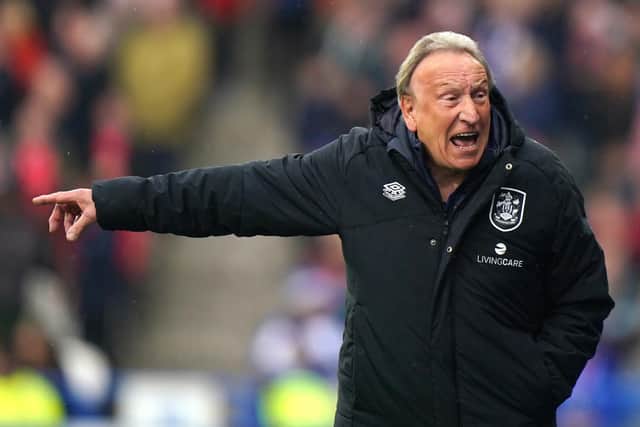 ENERGETIC: Huddersfield Town manager Neil Warnock is a livelier character on the touchline than his more relaxed senior counterpart Roy Hodgson of Crystal Palace