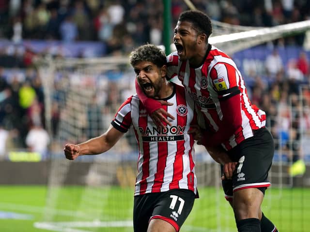 Sheffield United's Reda Khadra celebrates scoring the winning goal with team-mate Rhian Brewster (right) during the Sky Bet Championship match at the Swansea.com Stadium, Swansea. Picture: David Davies/PA Wire.