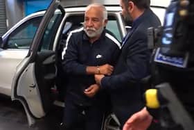 Piran Ditta Khan being taken into custody at  Elland Road Police Station in April 2023. Photo credit: West Yorkshire Police/PA Wire