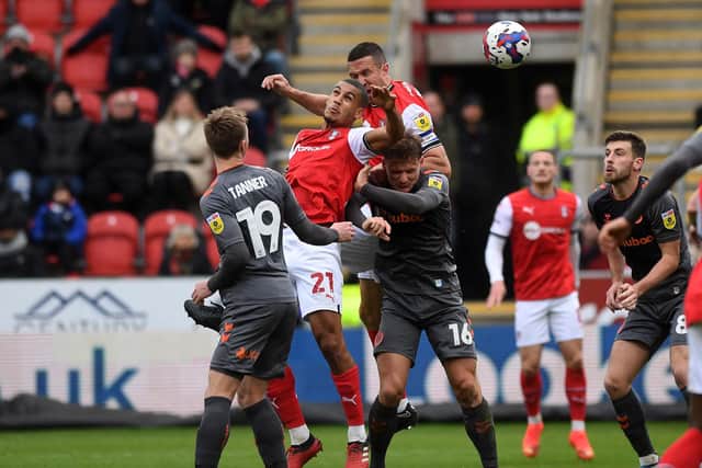Heads-up: Rotherham United defenders Lee Peltier (centre) and Richard Wood rise high against Bristol City. Picture: Jonathan Gawthorpe.