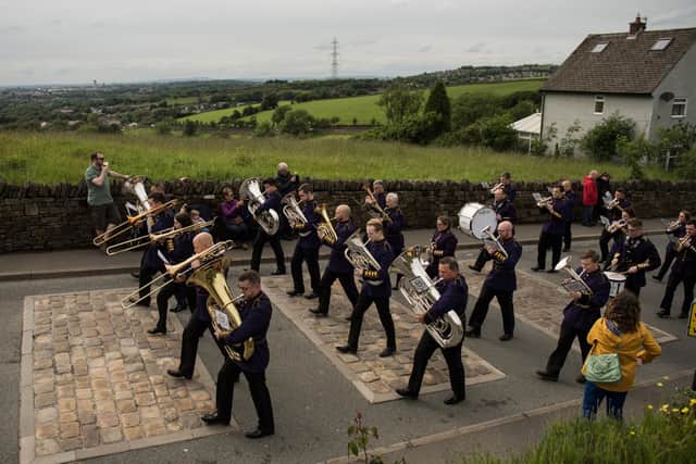 Members of Brighouse and Rastrick Band play in the Whit Friday brass band competition back in 2019. Picture: OLI SCARFF/AFP via Getty Images