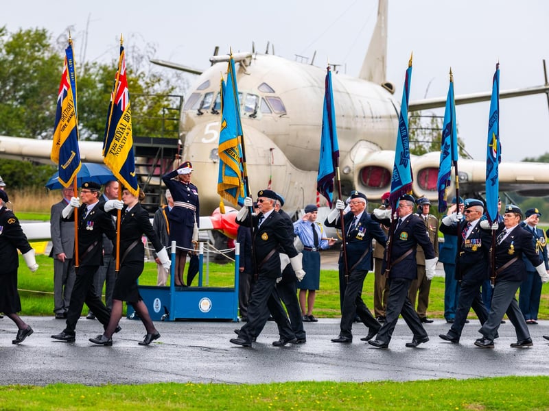 Pictured Jo Ropner, The Lord Lieutenant of North Yorkshire, stands on the saluting dais as the Standards march out at the end of the ceremony with the backdrop of the Hawker Siddeley Nimrod MR2 XV250. Picture: James Hardisty. Date: 6th September 2026.
